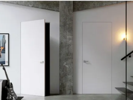 Porta battente per interni in laccato bianco come la parete Gea Filo muro di Doal